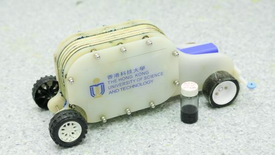 A demonstration vehicle with a bottle of the e-fuel.