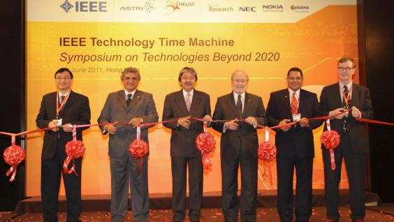  Ribbon cutting by the officiating party. (From left) Dr Cheung Nim-kwan, General Co-Chair of the Organizing Committee; Prof. Roberto de Marca, Executive Chairman of the Organizing Committee; Mr John Tsang, Financial Secretary, Hong Kong SAR Government; Dr Gordon Day, President-Elect, IEEE; Prof. K. B. Letaief, General Co-Chair of the Organizing Committee and HKUST Dean of Engineering; and Prof. Yrjö Neuvo, Program Committee Chair.