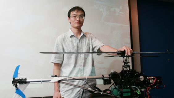 MPhil student Wang Tao and his mini-helicopter	