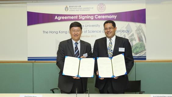 HKUST Dean of Engineering Prof Khaled Ben Letaief (right) and Dean of Graduate School at Shenzhen, Tsinghua University Prof Feiyu Kang sign the agreement at HKUST.