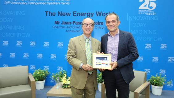  President Tony Chan (left) presents a souvenir to Mr Tricoire.
