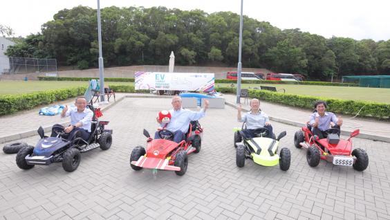  The four judges of the competition take a ride on the cars that the students had built – (from left) Prof Tim Cheng; Prof Roy Chung; Mr Chow Tang Fai; and Prof Ben Chan, Associate Professor of Engineering Education and Associate Director of the Academy for Bright Future Young Engineers.