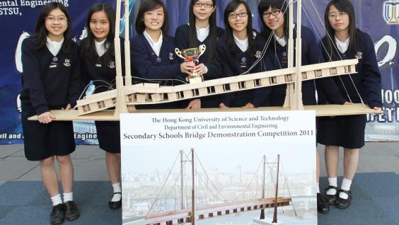  The winning team - from Maryknoll Convent School - with their bridge after the competition, and their award